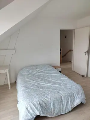 Un ou plusieurs lits dans un hébergement de l'établissement Maison 3 chambres