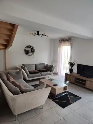 Coin salon dans l'établissement Maison 3 chambres