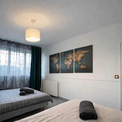 Un ou plusieurs lits dans un hébergement de l'établissement Élégant rez-de-jardin 4 chambres à Angers