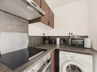 Cuisine ou kitchenette dans l'établissement Appart pour 2 à St-Jean-de-Mont avec jardin