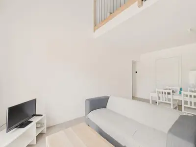 Télévision ou salle de divertissement dans l'établissement Appartement pour 4 à St-Jean-de-Mont - Jardin