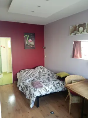 Un ou plusieurs lits dans un hébergement de l'établissement Chambre cosy
