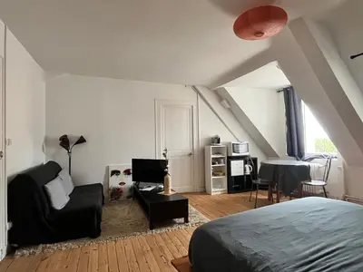 Un ou plusieurs lits dans un hébergement de l'établissement Appartements des Halles - Chambres d'Hôtes