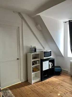 Télévision ou salle de divertissement dans l'établissement Appartements des Halles - Chambres d'Hôtes