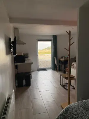 Télévision ou salle de divertissement dans l'établissement Studio de la Baroud Family