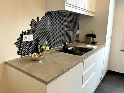 Cuisine ou kitchenette dans l'établissement Intemporel 4 pers 2 chambres TV WiFi