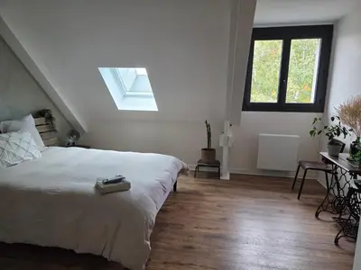 Un ou plusieurs lits dans un hébergement de l'établissement MAISON FAMILIALE 4 CHAMBRE PISCINE 5mn DU CENTRE VILLE