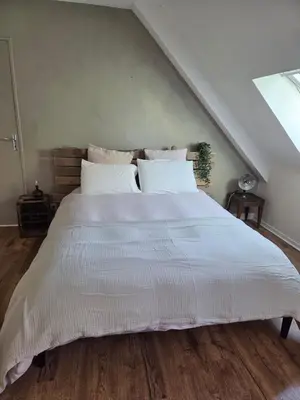 Un ou plusieurs lits dans un hébergement de l'établissement MAISON FAMILIALE 4 CHAMBRE PISCINE 5mn DU CENTRE VILLE