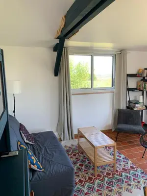 Coin salon dans l'établissement Le 13 bis