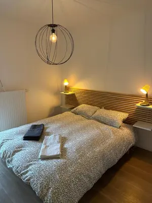 Un ou plusieurs lits dans un hébergement de l'établissement Charming room Île de Nantes