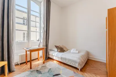 Un ou plusieurs lits dans un hébergement de l'établissement Hélios - Élégant appartement de 115 m² à Nantes