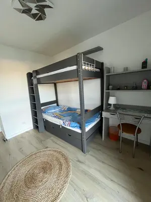 Un ou plusieurs lits dans un hébergement de l'établissement Appartement Joshua 3 chambres & grande terrasse