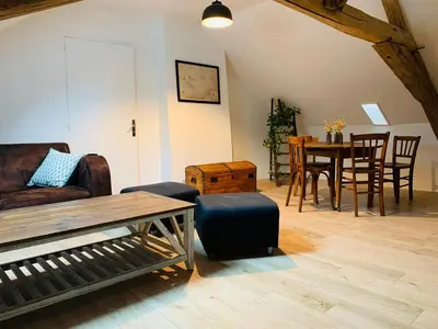 Coin salon dans l'établissement Appartement dans maison avec jardin privatif