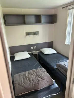 Un ou plusieurs lits dans un hébergement de l'établissement Mobil-home 6 pers proche Puy duFou