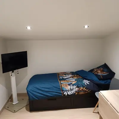 Un ou plusieurs lits dans un hébergement de l'établissement Studio chez l'habitant
