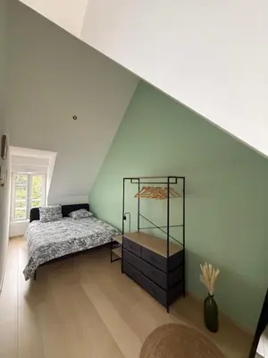 Un ou plusieurs lits dans un hébergement de l'établissement Appartement vue sur le vieux port de Pornic