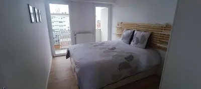 Un ou plusieurs lits dans un hébergement de l'établissement Appartement lumineux et cosy