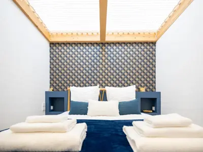 Un ou plusieurs lits dans un hébergement de l'établissement Loft 23 - Appartement lumineux 4 chambres hyper centre de Cholet