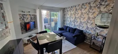 Coin salon dans l'établissement Sublime Appartement rdc T2 Proche mer et parc