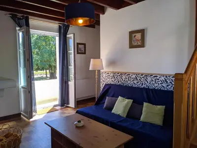 Coin salon dans l'établissement Maison au bord du canal - L'échappée belle