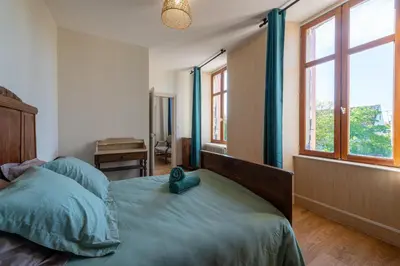 Un ou plusieurs lits dans un hébergement de l'établissement La Maison du Bonheur - Grand Jardin