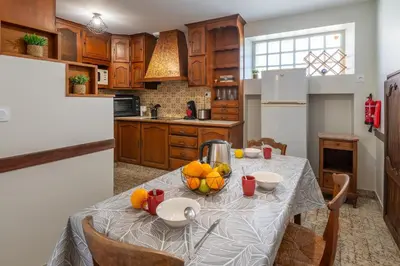 Cuisine ou kitchenette dans l'établissement La Maison du Bonheur - Grand Jardin