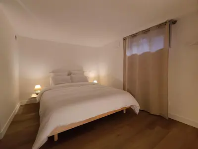 Un ou plusieurs lits dans un hébergement de l'établissement Cocon du Tisserand - Centre ville - Cosy et Intimiste