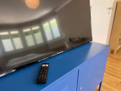 Télévision ou salle de divertissement dans l'établissement Chambre cozy avec sdb privée à 7min de la gare