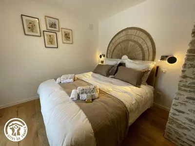 Un ou plusieurs lits dans un hébergement de l'établissement Gîte Vendée avec Spa et Terrasse - FR-1-426-592