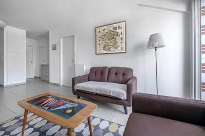 Coin salon dans l'établissement Appartement proche plage et bourg