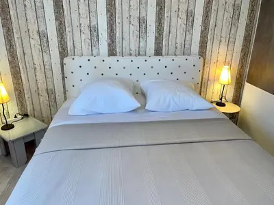 Un ou plusieurs lits dans un hébergement de l'établissement Le Relais du 49 - Gîte