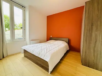 Un ou plusieurs lits dans un hébergement de l'établissement Charmant appartement tout confort