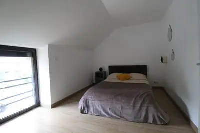 Un ou plusieurs lits dans un hébergement de l'établissement Maison en pierre lumineuse avec véranda & jardin clos, 8 pers entre Nantes et la mer
