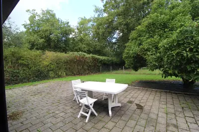 Jardin de l'établissement Maison en pierre lumineuse avec véranda & jardin clos, 8 pers entre Nantes et la mer