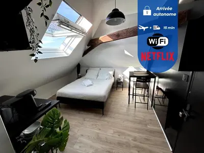Un ou plusieurs lits dans un hébergement de l'établissement Le Studio - Cosy et fonctionnel - plein centre