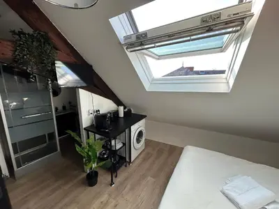 Un ou plusieurs lits dans un hébergement de l'établissement Le Studio - Cosy et fonctionnel - plein centre