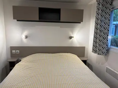 Un ou plusieurs lits dans un hébergement de l'établissement Mobil-home 8 personnes proche plage et foret