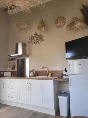 Cuisine ou kitchenette dans l'établissement Bel des Prés - Cocùn - Piscine partagée