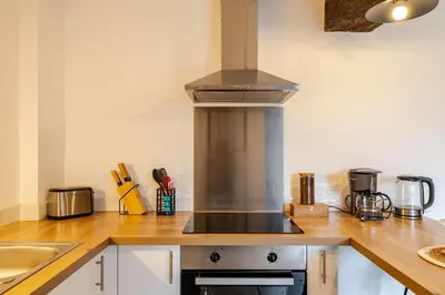 Cuisine ou kitchenette dans l'établissement L'Atelier Jolie maison de charme proche Puy duFou