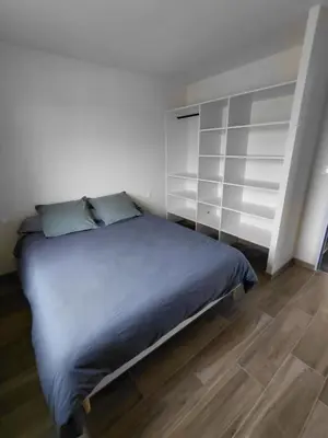 Un ou plusieurs lits dans un hébergement de l'établissement Gîte du champ aisé