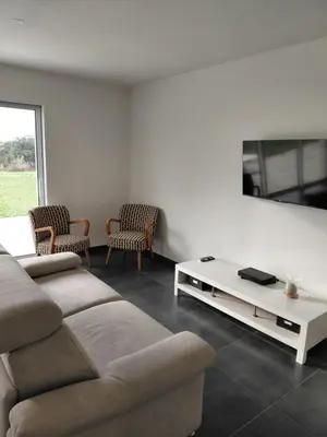 Télévision ou salle de divertissement dans l'établissement Gîte du champ aisé