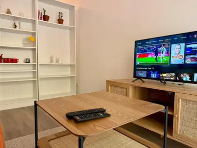 Télévision ou salle de divertissement dans l'établissement Appartement Cosy Bord de Lac