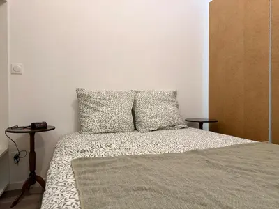 Un ou plusieurs lits dans un hébergement de l'établissement Appartement Cosy Bord de Lac