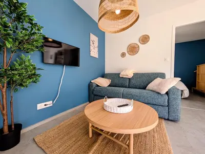 Télévision ou salle de divertissement dans l'établissement La maison du petit large