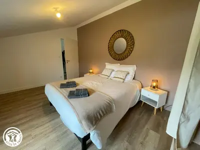 Un ou plusieurs lits dans un hébergement de l'établissement Spacieux Gîtes en Vendée avec Piscine Chauffée - FR-1-426-596