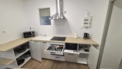 Cuisine ou kitchenette dans l'établissement Appartement cosy neuf en plein centre