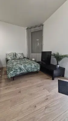 Coin salon dans l'établissement Appartement cosy neuf en plein centre