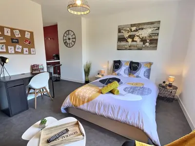 Un ou plusieurs lits dans un hébergement de l'établissement Studio 31, calme et chaleureux près du PuyDuFou