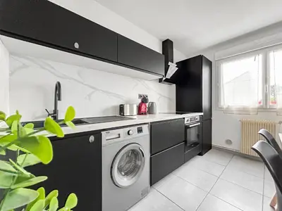 Cuisine ou kitchenette dans l'établissement Appartement cosy, plage et parking privé