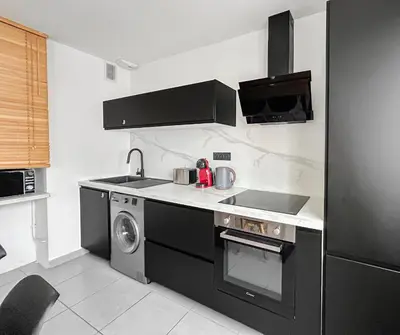 Cuisine ou kitchenette dans l'établissement Appartement cosy, plage et parking privé